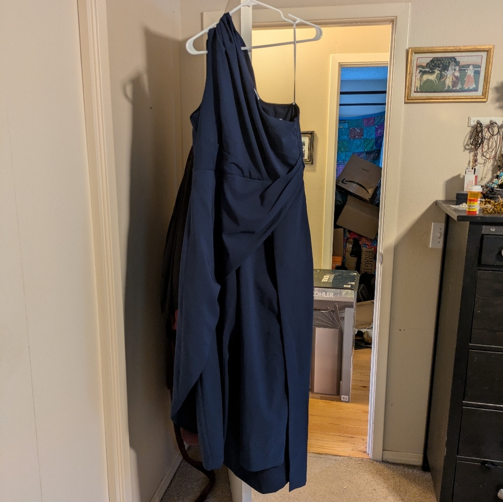 Kay Unger blue one shoulder jumpsuit.